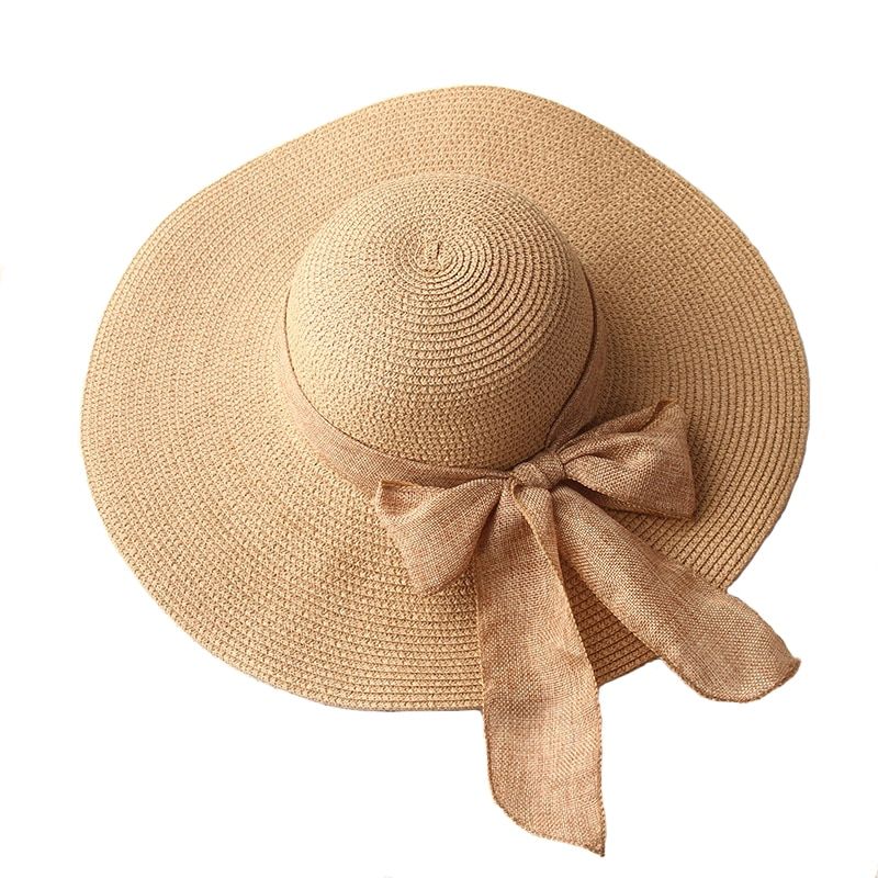 Straw hat with wide brim and bow